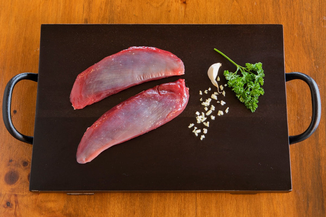 raw small portion cuts of ostrich strips
