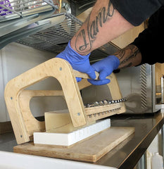 slicing artisan ostrich oil soaps